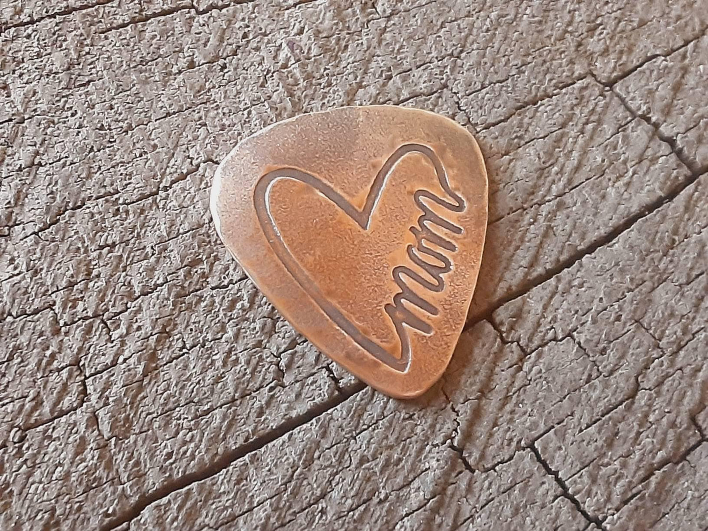 Mom guitar pick in bronze
