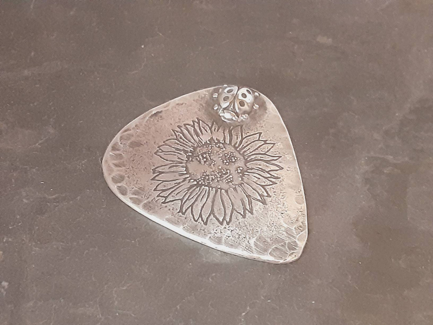 Guitar pick and stand combination in sterling silver with sunflower design and 3D soldered ladybug