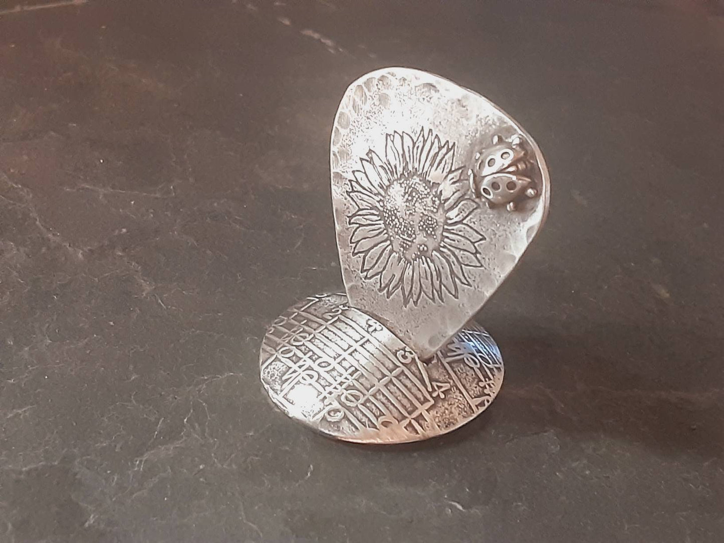 Guitar pick and stand combination in sterling silver with sunflower design and 3D soldered ladybug