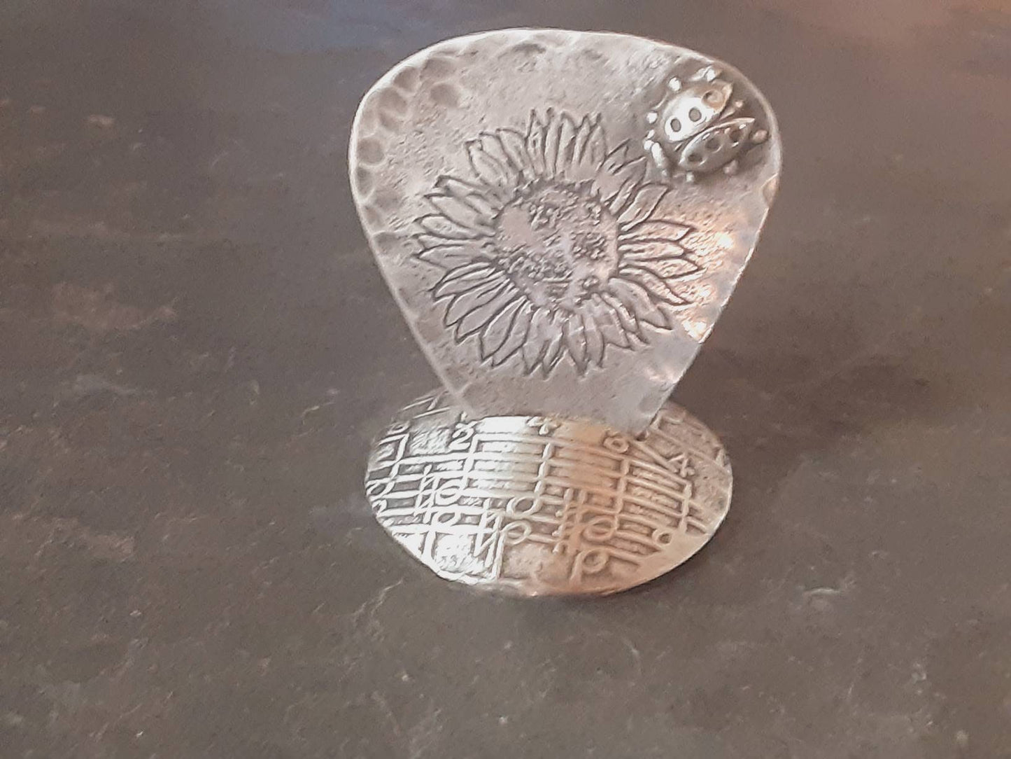 Guitar pick and stand combination in sterling silver with sunflower design and 3D soldered ladybug