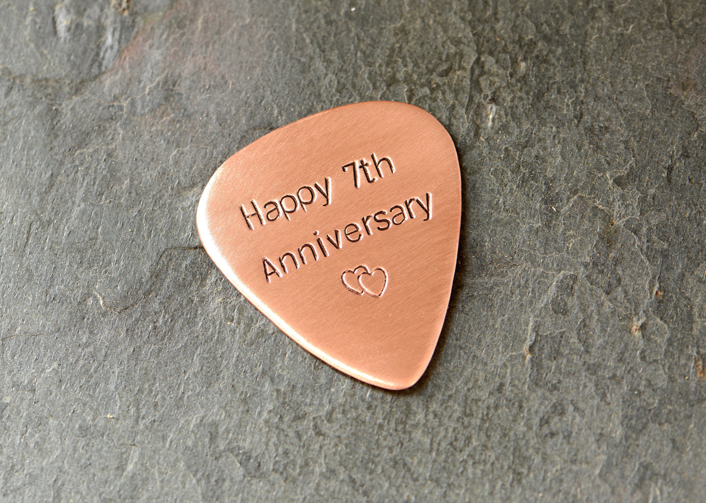 Copper guitar pick for the 7th anniversary or playing your guitar