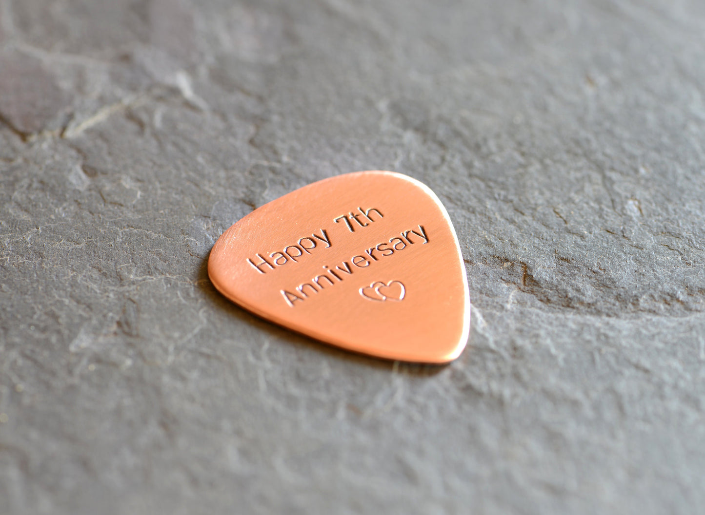 Copper guitar pick for the 7th anniversary or playing your guitar
