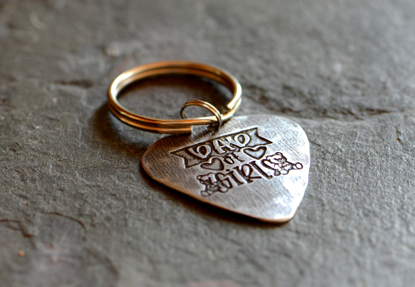 Sterling silver guitar pick keychain stamped with Dad of Girls