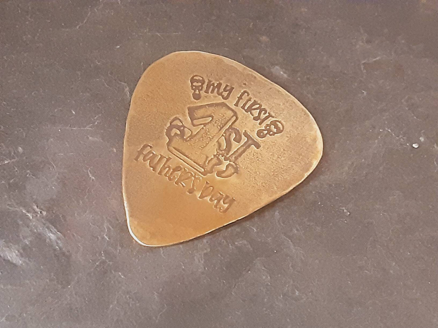 My first Fathers Day Brass Guitar Pick