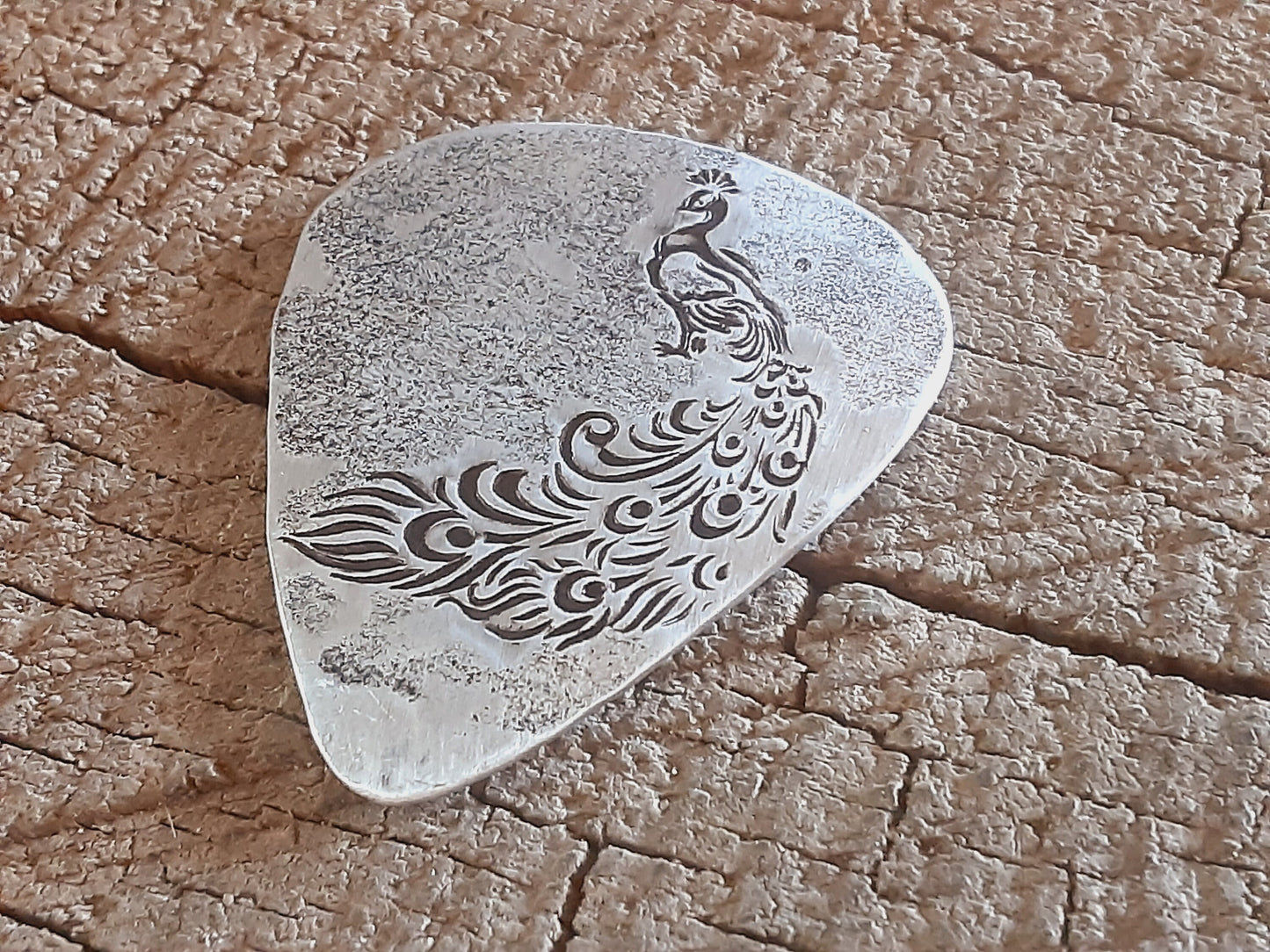 Sterling silver guitar pick with peacock