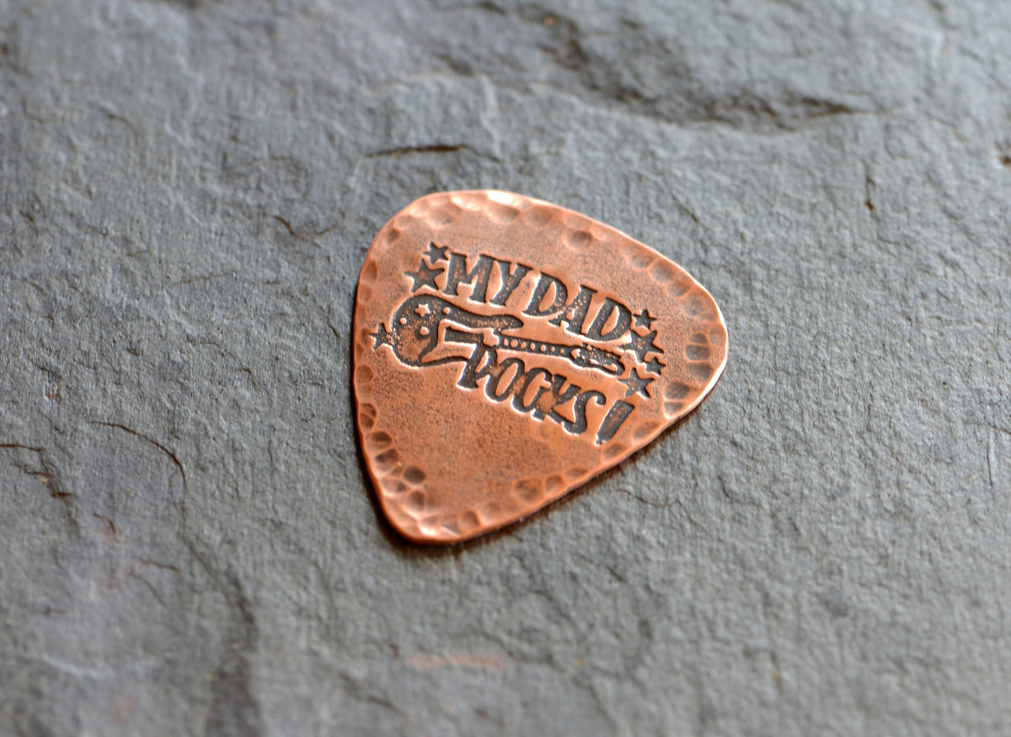 Guitar pick in rustic copper