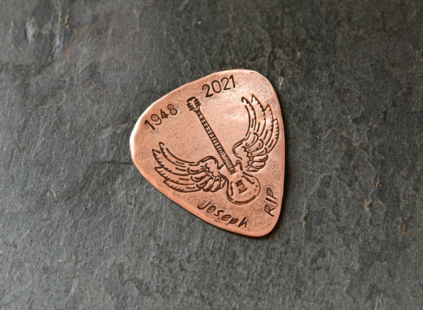 Memorial winged guitar on pick with custom date and name