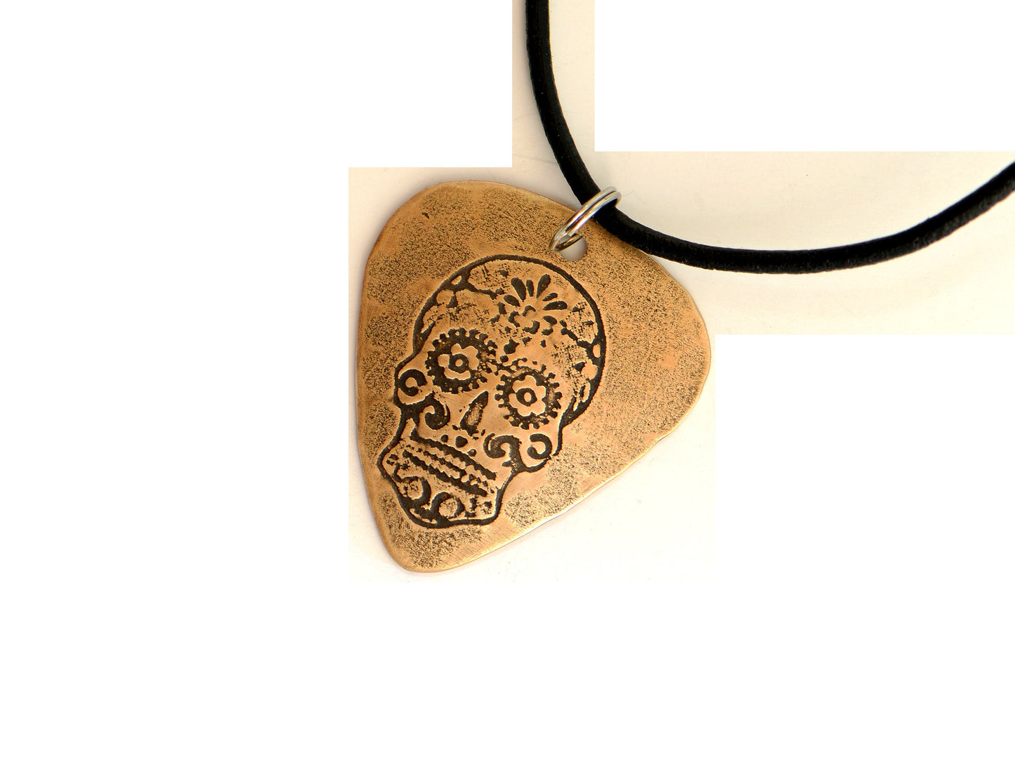 Bronze guitar pick with sugar skull necklace