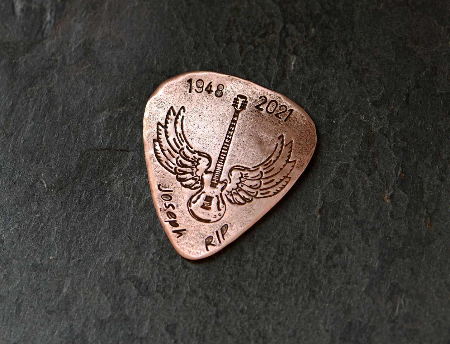 Memorial winged guitar on pick with custom date and name