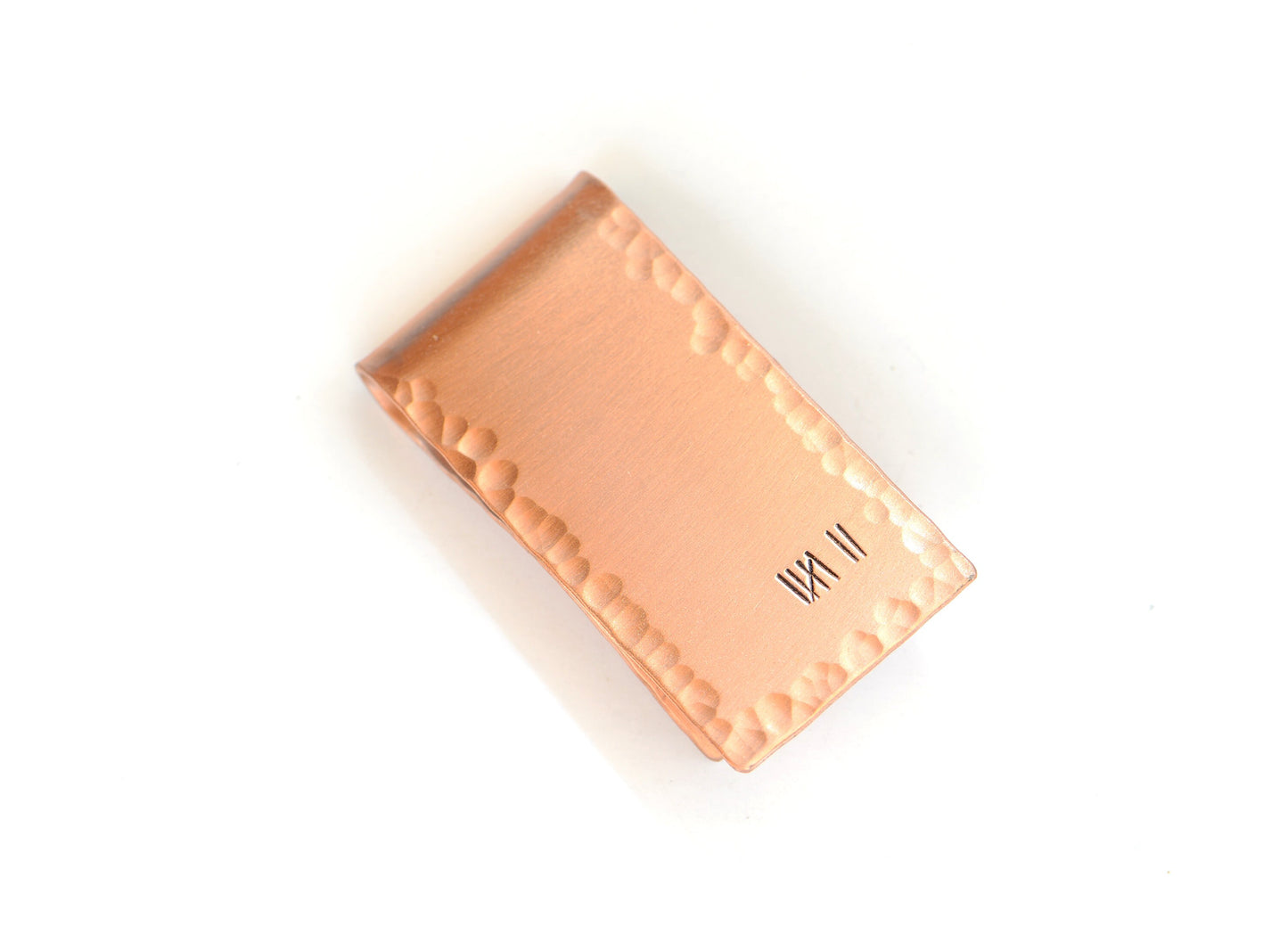 Copper money clip for the 7th anniversary with 7 tally marks to keep track