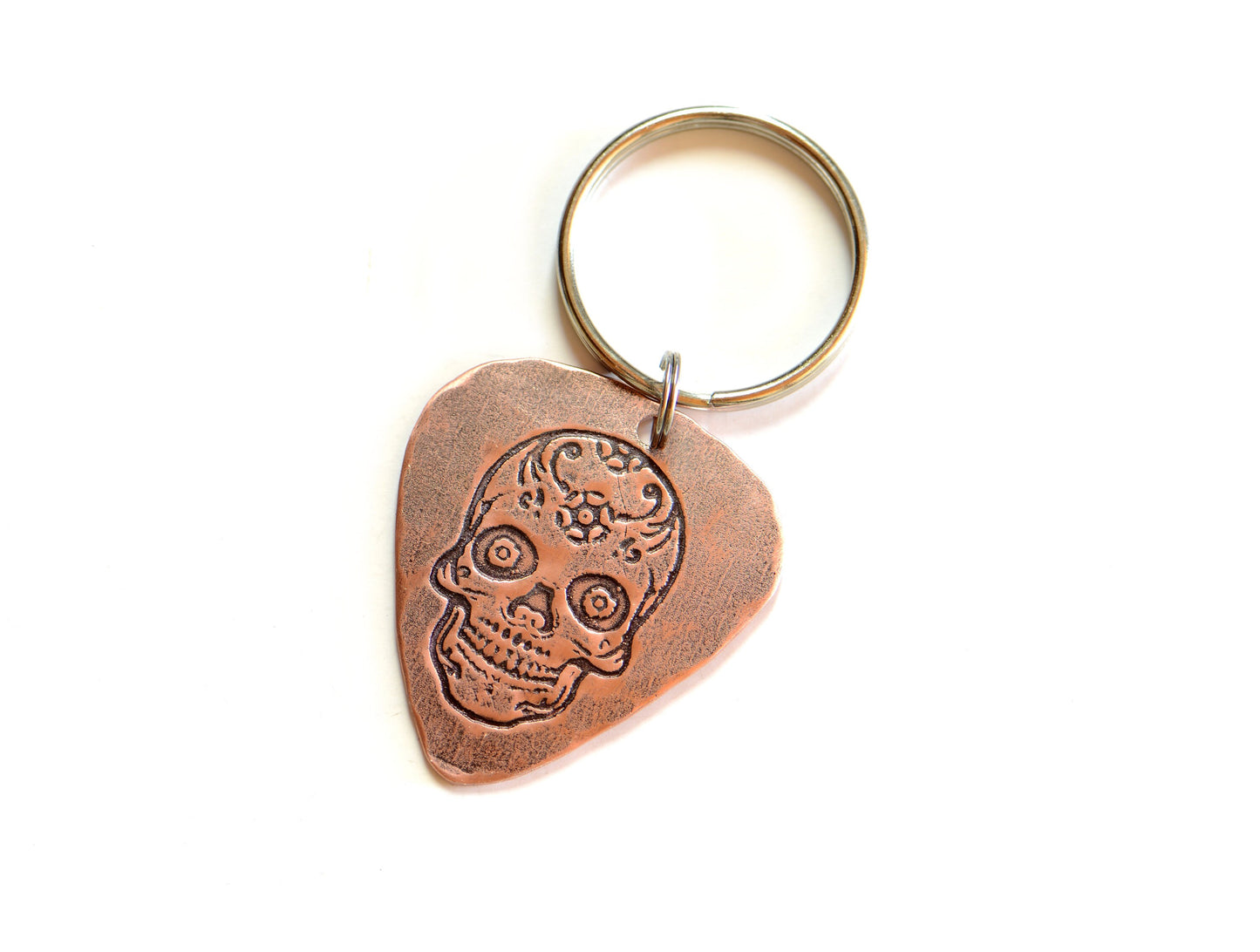 Copper guitar pick key chain with sugar skull