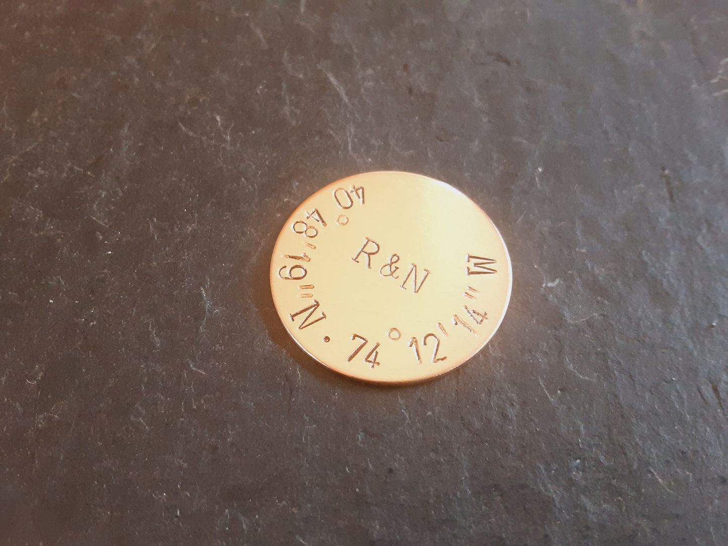 Bronze golf ball marker with latitude longitude