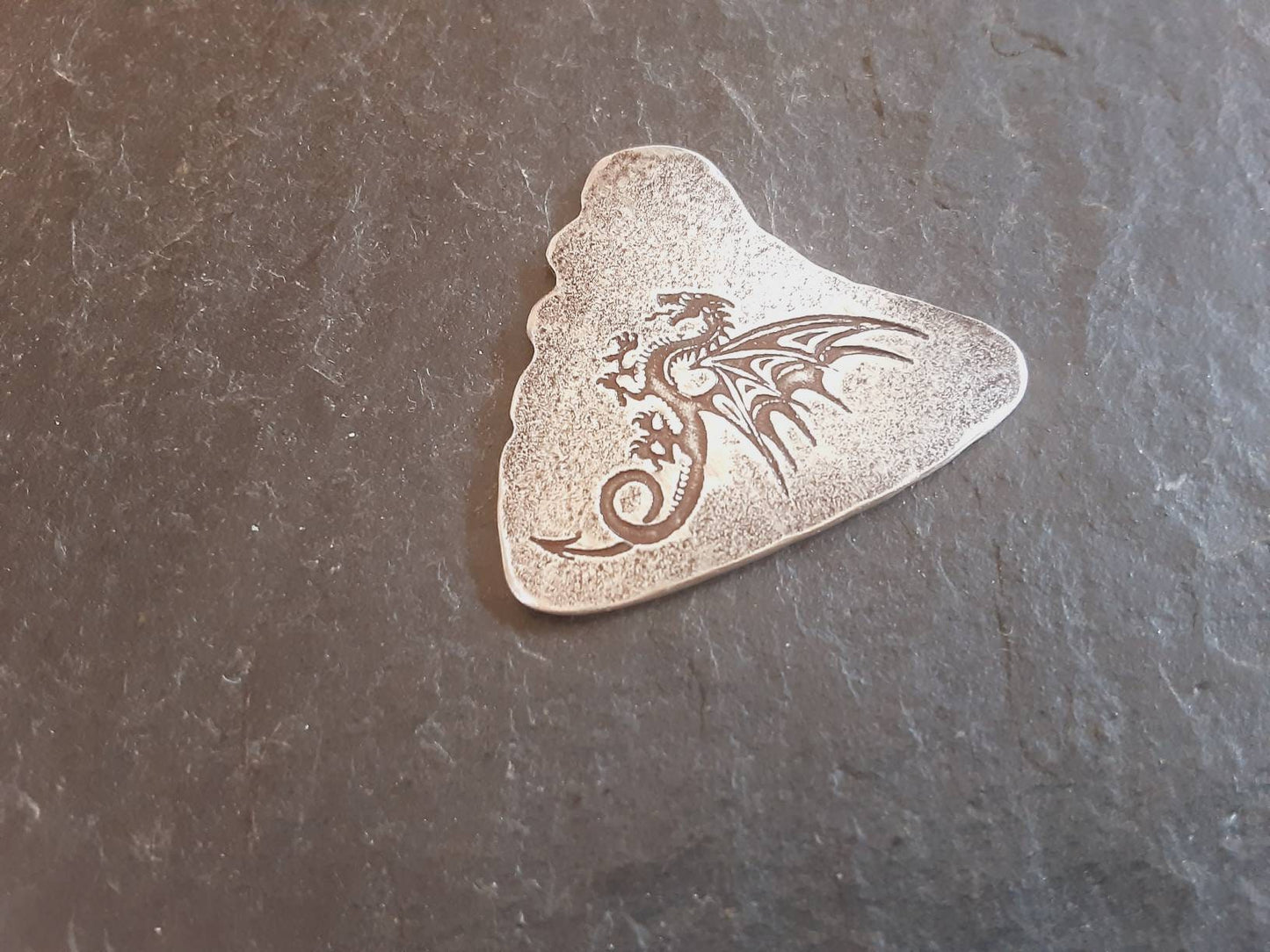Sterling silver shark tooth guitar pick with dragon design