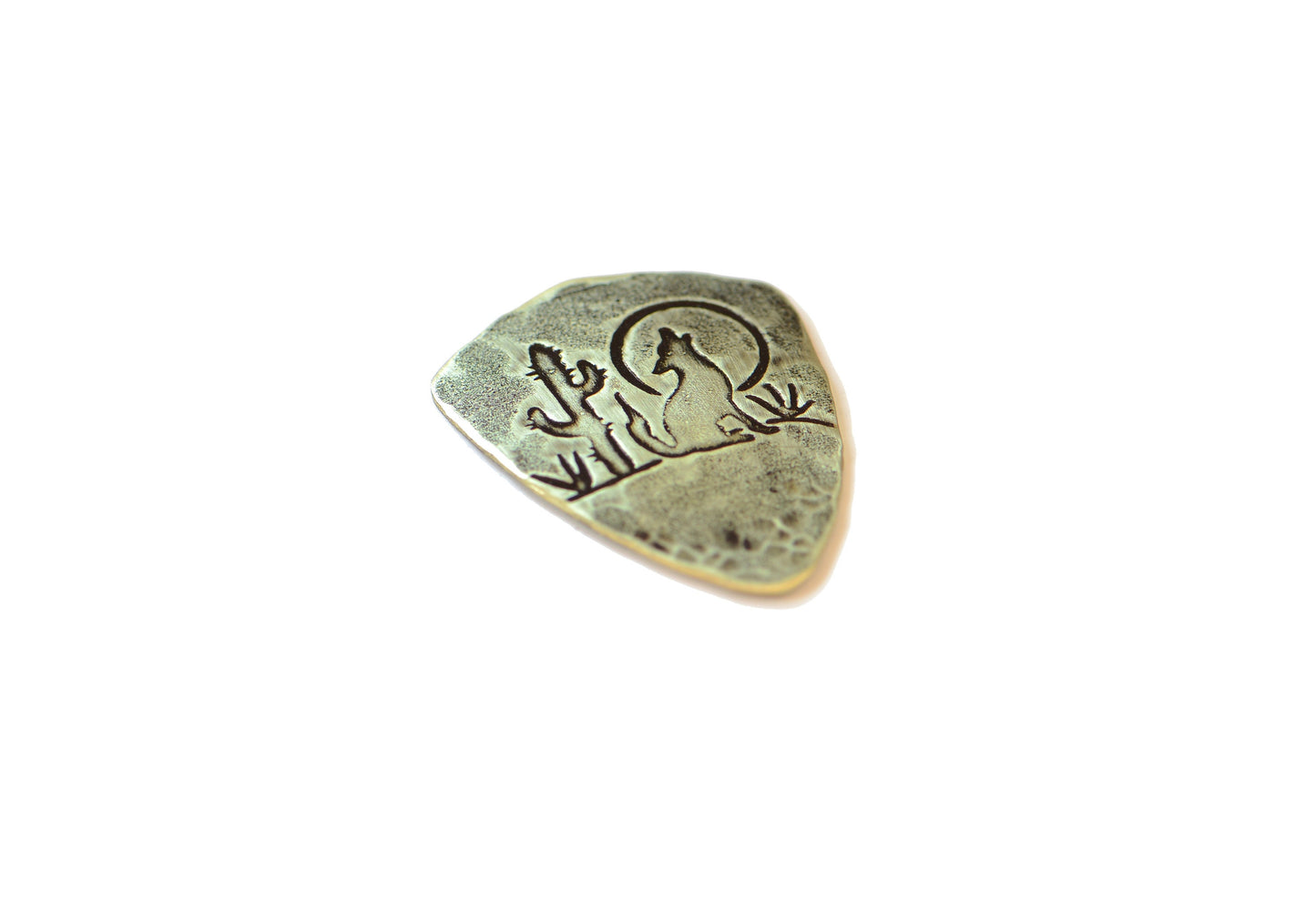 Shield style brass guitar pick with coyote moon and Saguaro cactus