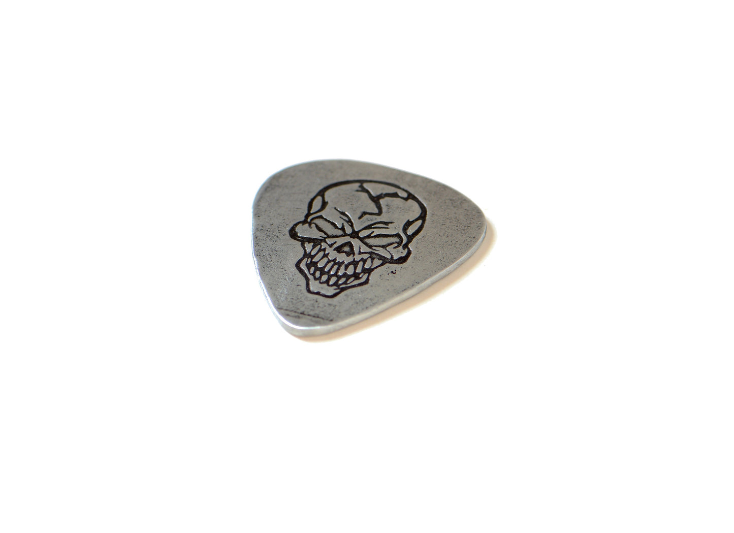 Sterling silver guitar pick with skull design