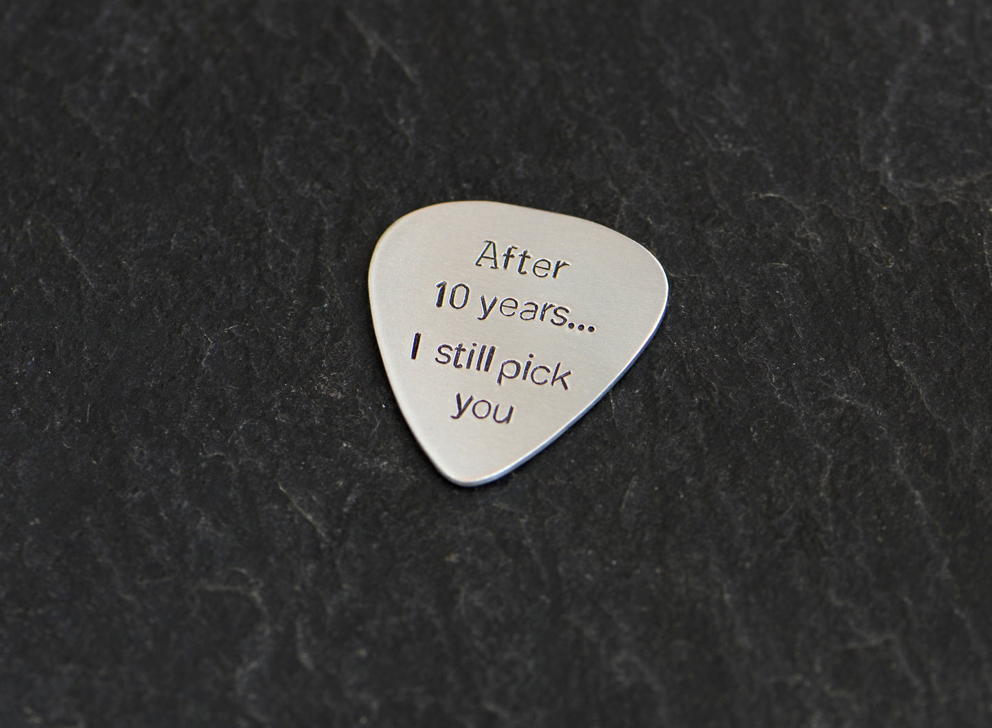 Aluminum guitar pick for 10th anniversaries aka aluminum anniversaries