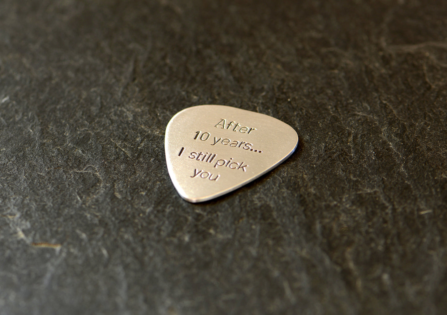 Aluminum guitar pick for 10th anniversaries aka aluminum anniversaries