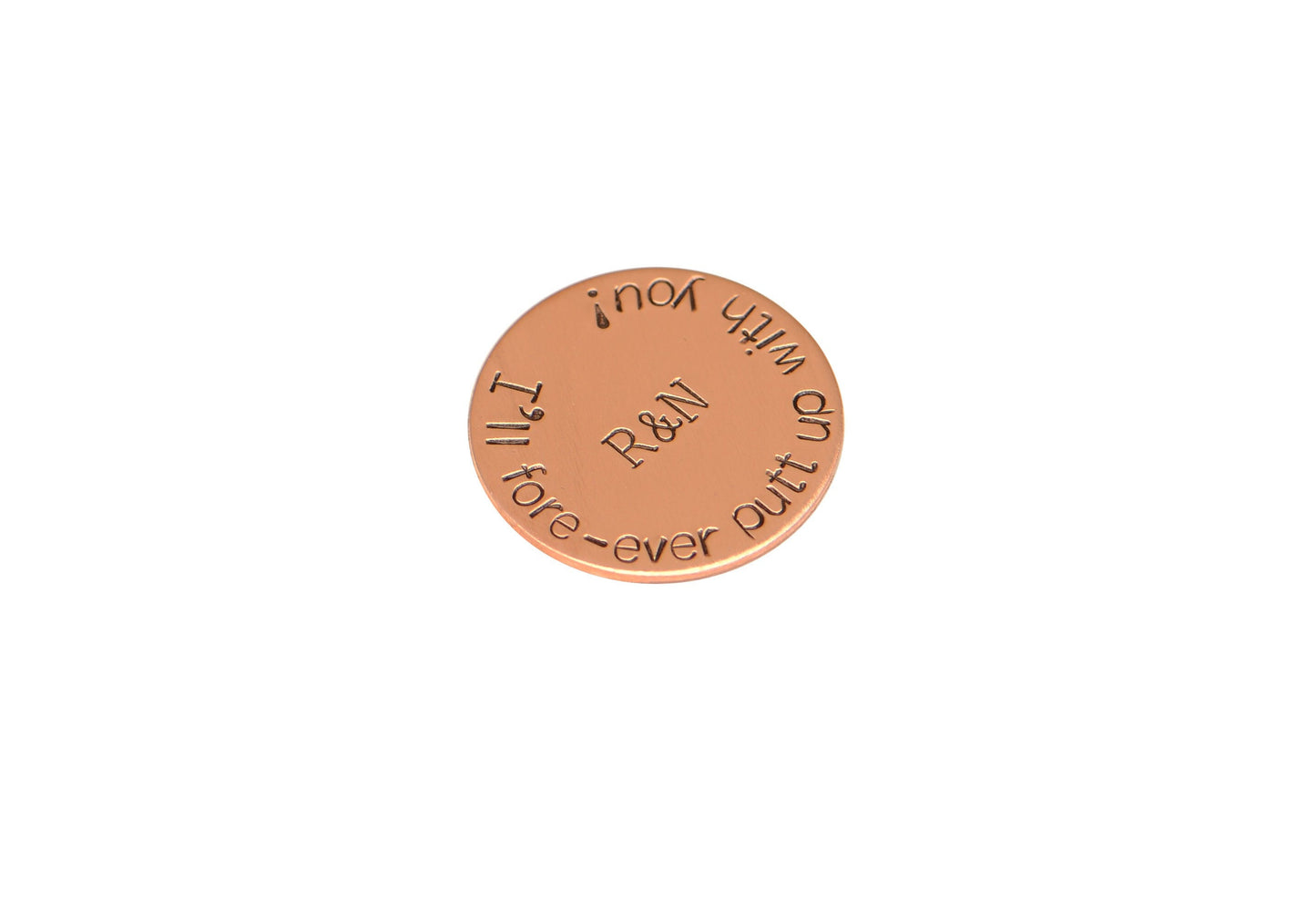 Initials on copper golf ball marker