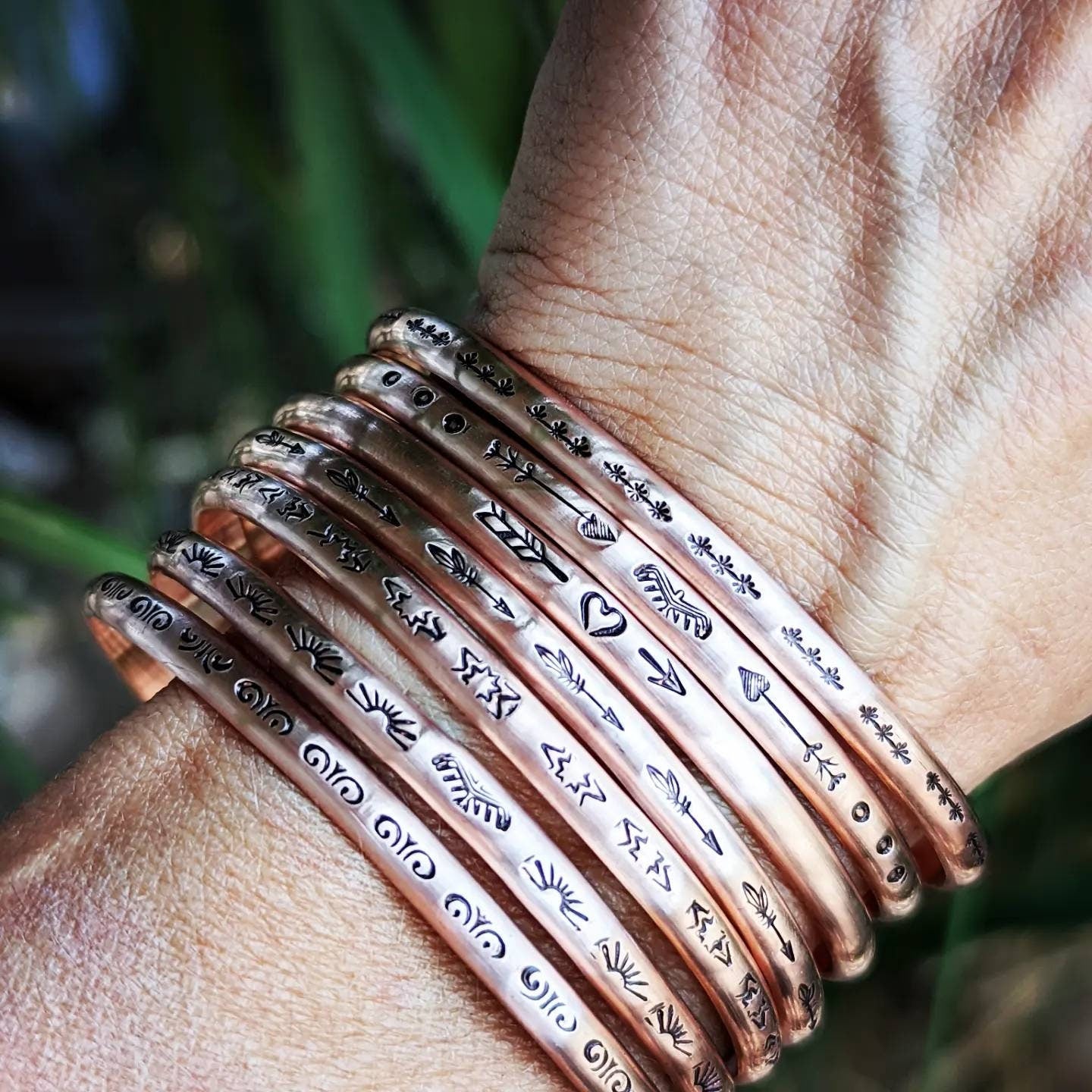 Copper cuff bracelets with stars and Thunderbird arrows