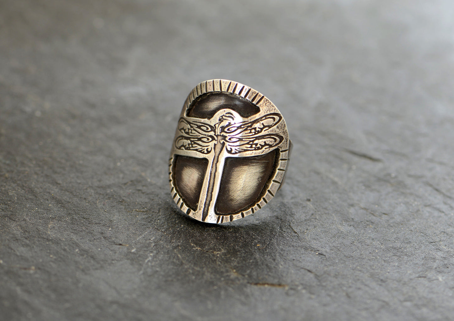 Sterling silver dragonfly design on a handcrafted saddle ring