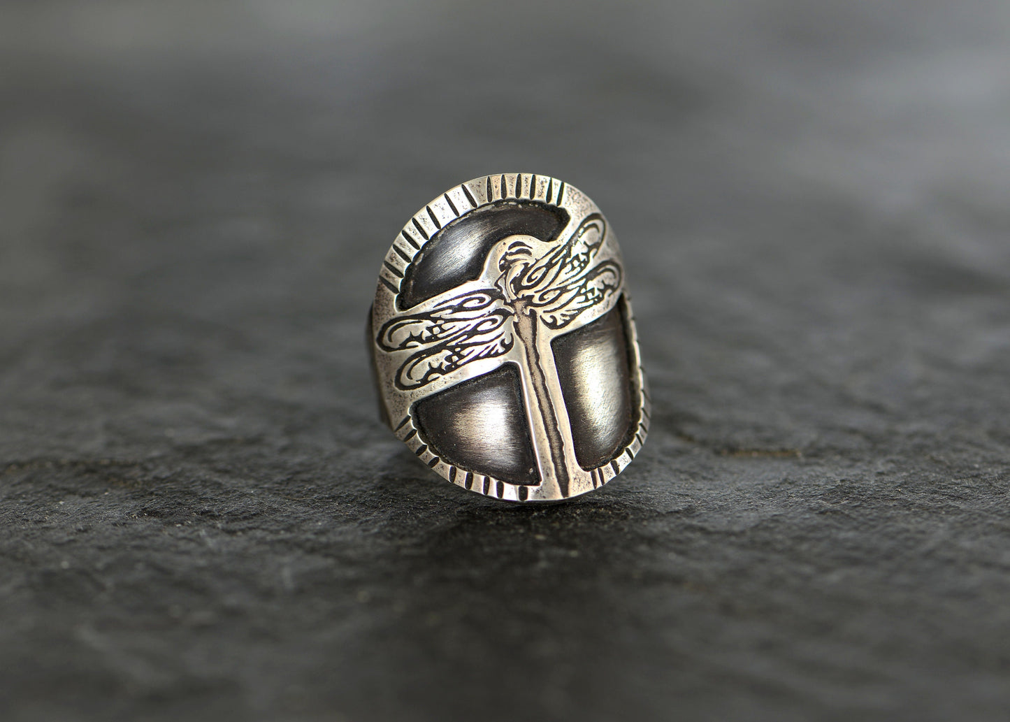 Sterling silver dragonfly design on a handcrafted saddle ring