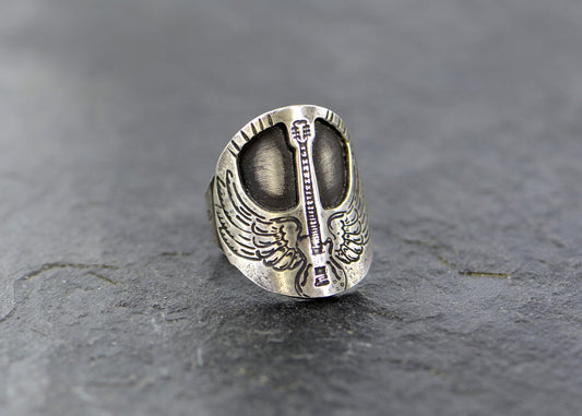 Winged guitar on  sterling silver saddle ring