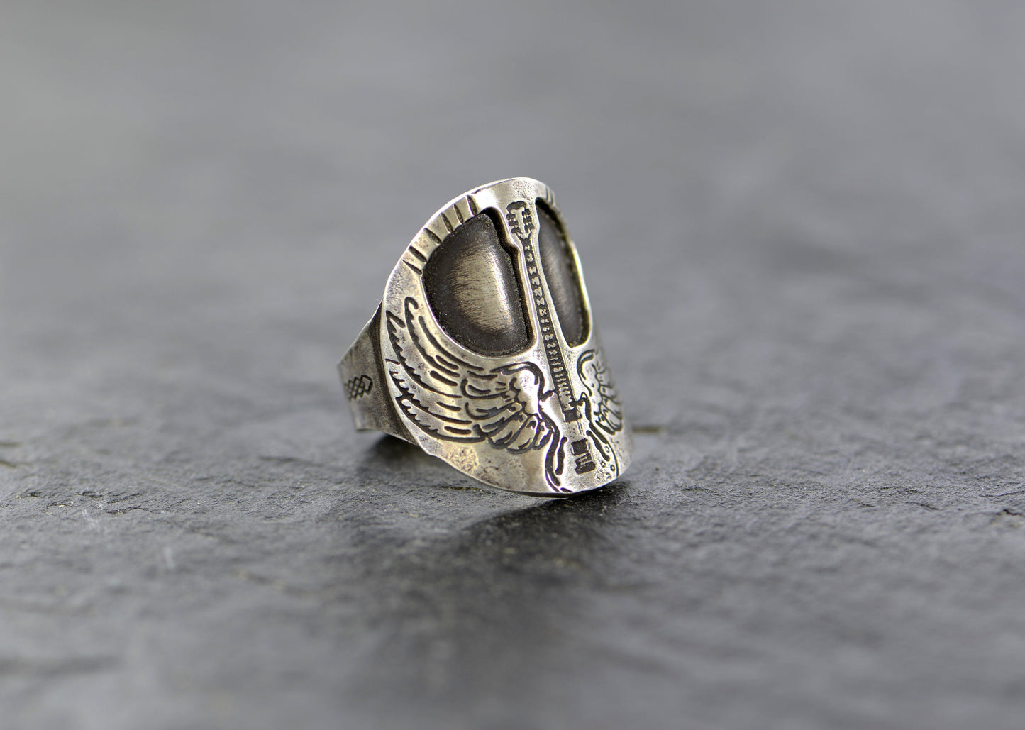 Winged guitar on  sterling silver saddle ring