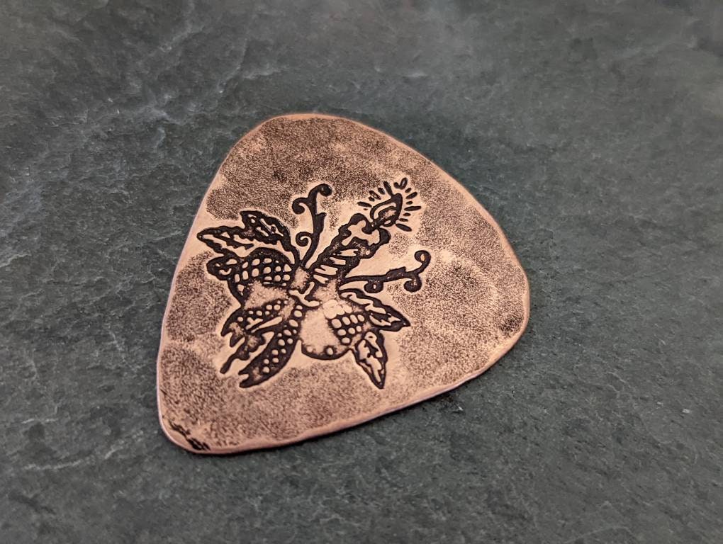 Guitar pick with Christmas Candle in bronze