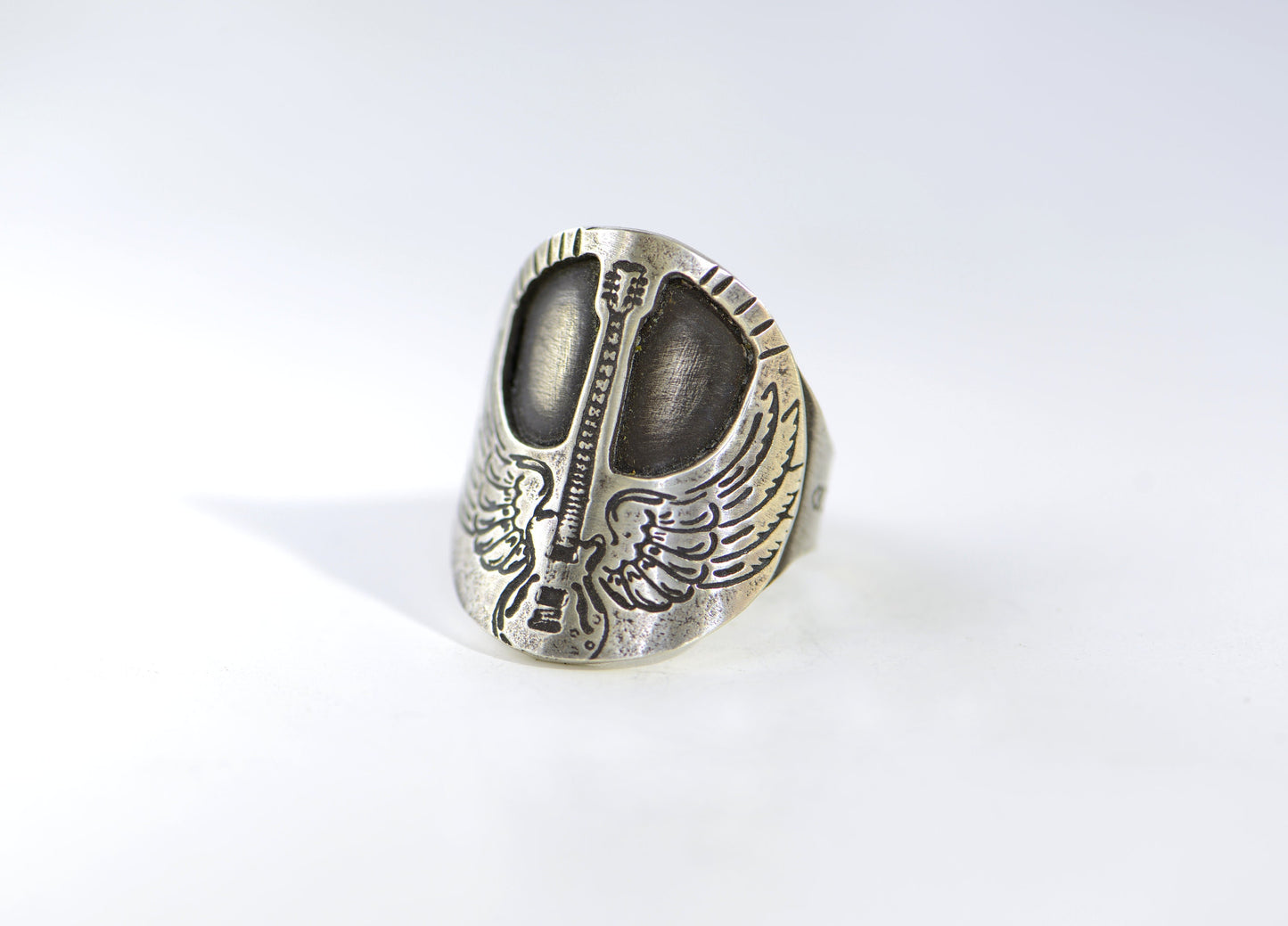 Winged guitar on  sterling silver saddle ring