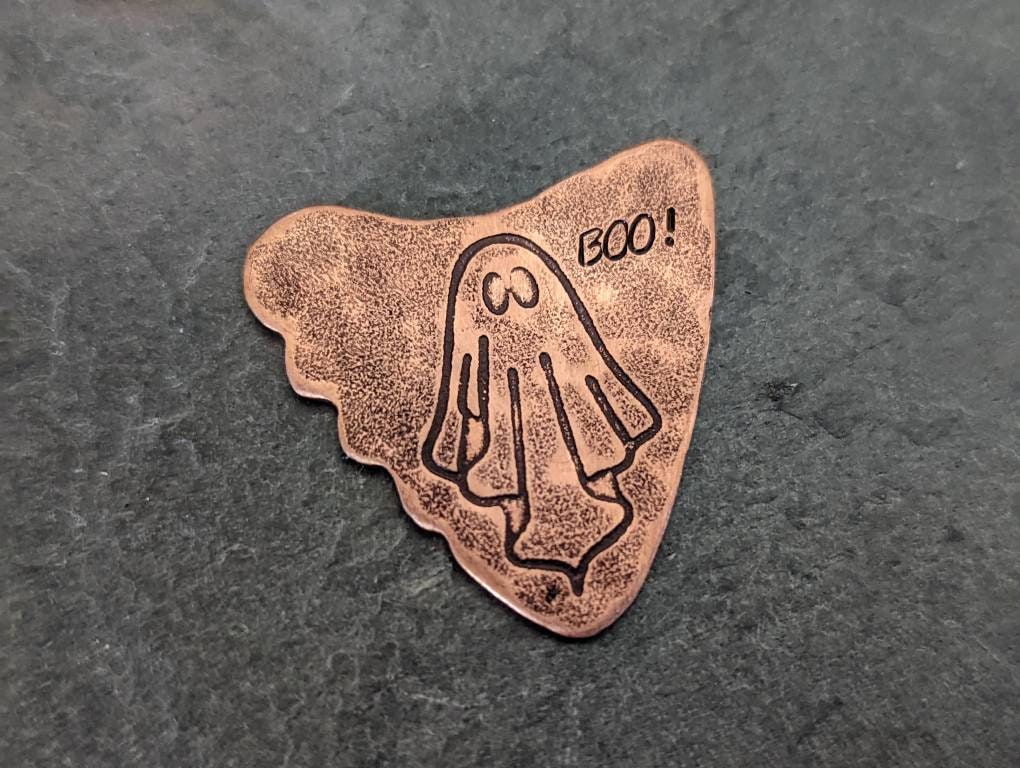 Copper shark tooth guitar pick with ghost and Boo