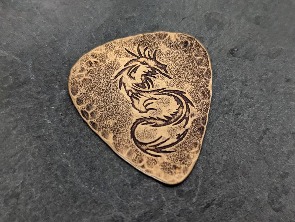 Bronze dragon guitar pick