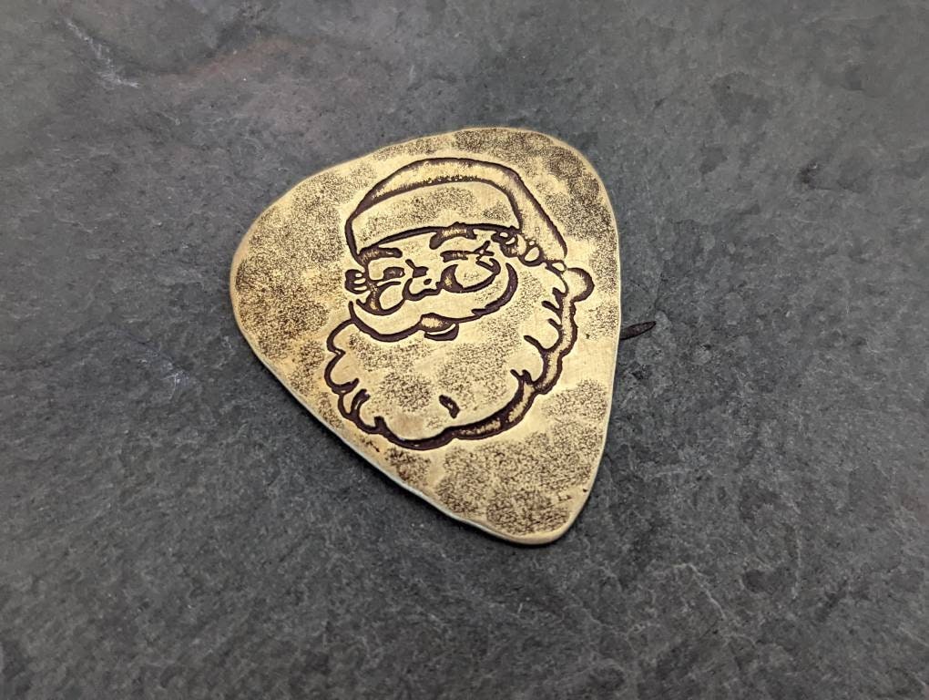 Santa Claus guitar pick in brass