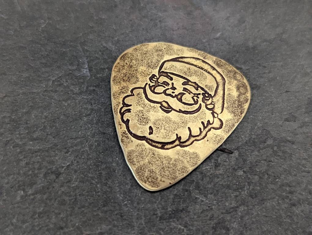 Santa Claus guitar pick in brass
