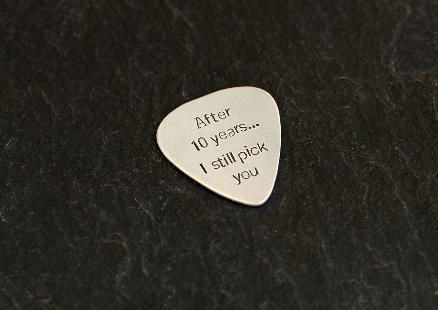 Aluminum guitar pick for 10th anniversaries aka aluminum anniversaries