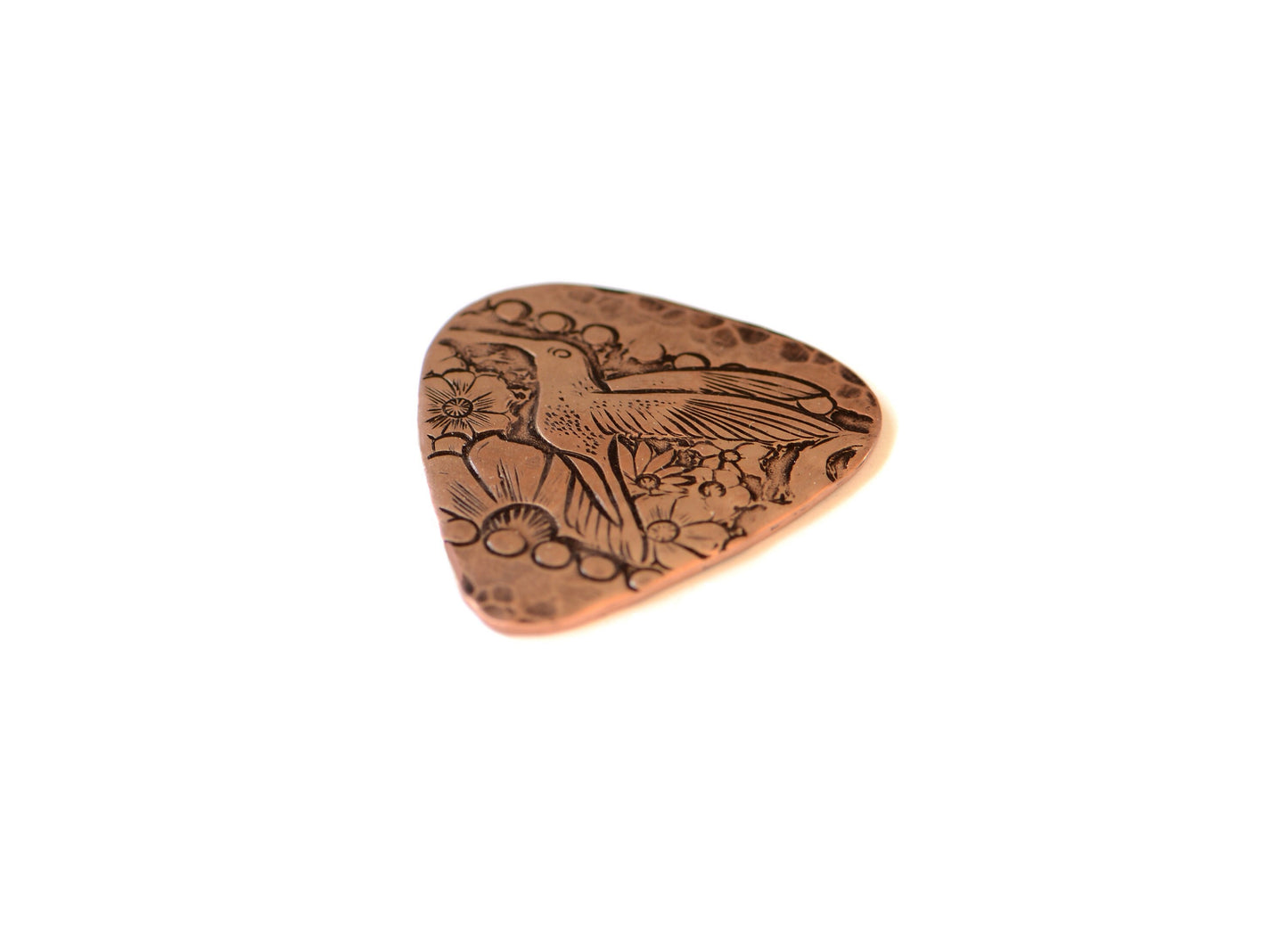 Guitar pick with hummingbird in copper