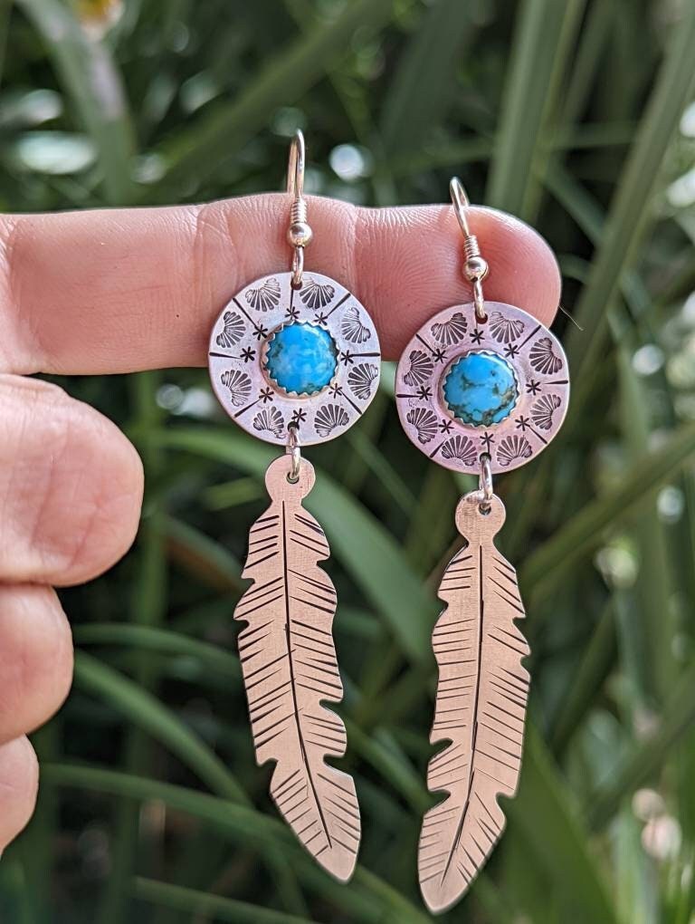 Sterling silver feather and shield earrings featuring 8mm Kingman mine turquoise and long dangle