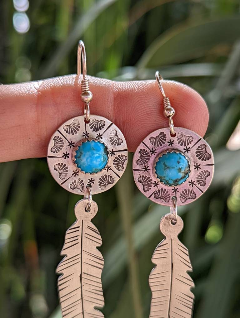 Sterling silver feather and shield earrings featuring 8mm Kingman mine turquoise and long dangle