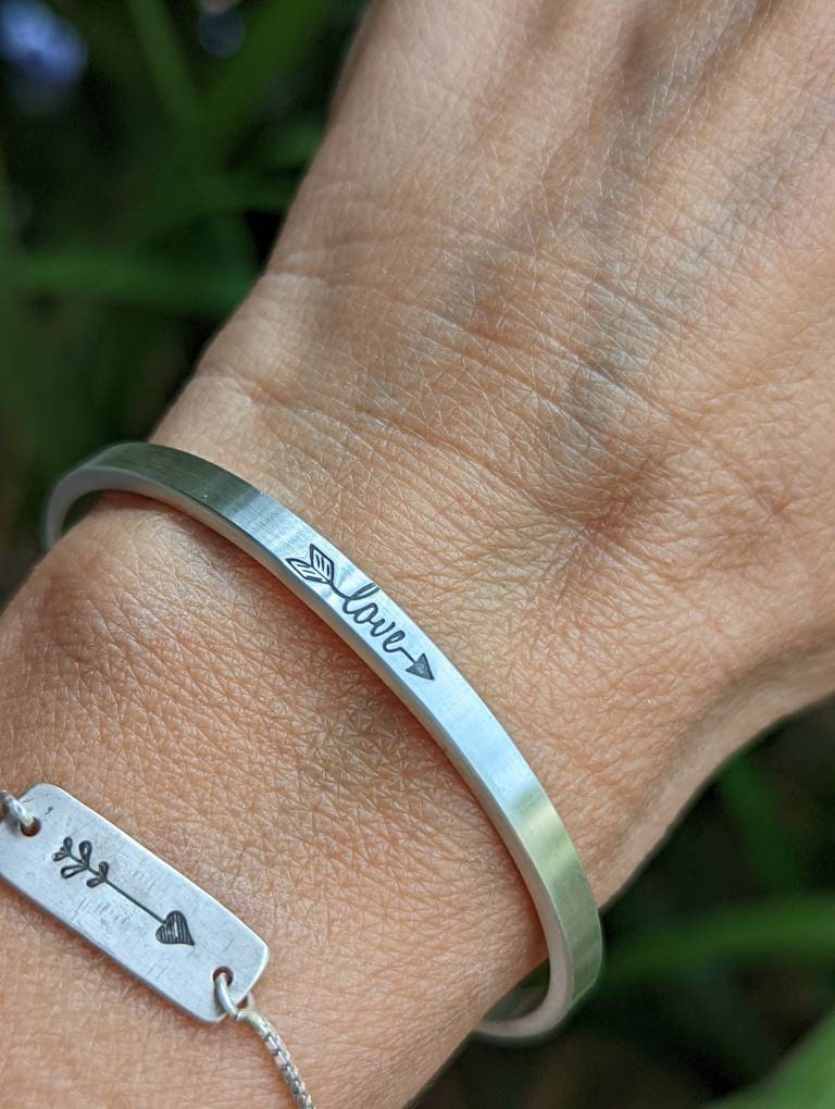 Dainty sterling silver bracelet with love and arrow