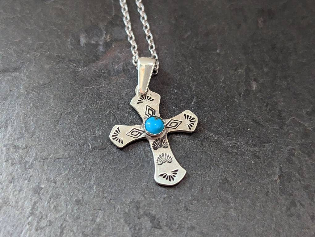 Sterling silver cross necklace featuring 5 mm Kingman Mine turquoise
