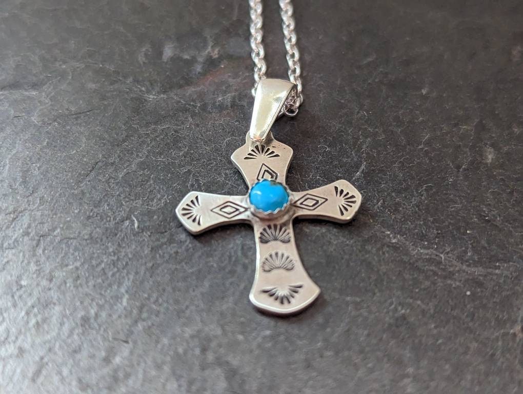 Sterling silver cross necklace featuring 5 mm Kingman Mine turquoise