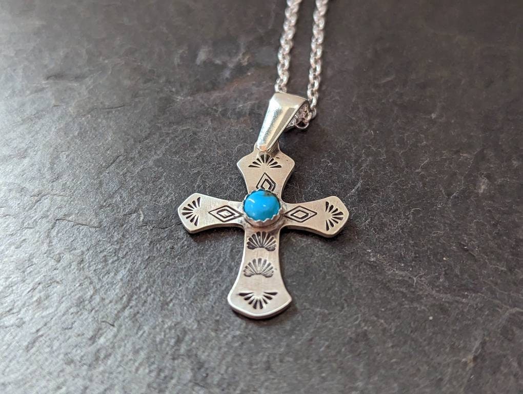 Sterling silver cross necklace featuring 5 mm Kingman Mine turquoise
