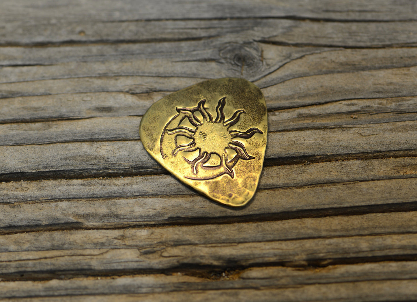 Sun and moon brass guitar pick - totally playable with hammered texture on back