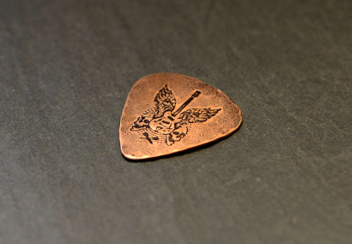 copper guitar pick - playable with winged guitar and skulls - signed guitar pick