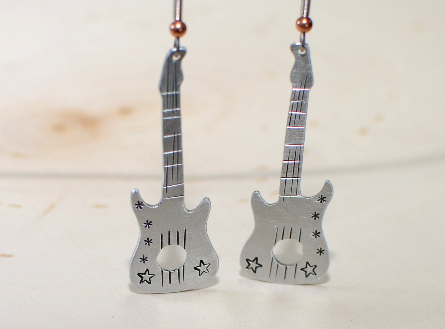 Guitar shaped handcrafted dangle earrings in your choice of aluminum or sterling silver