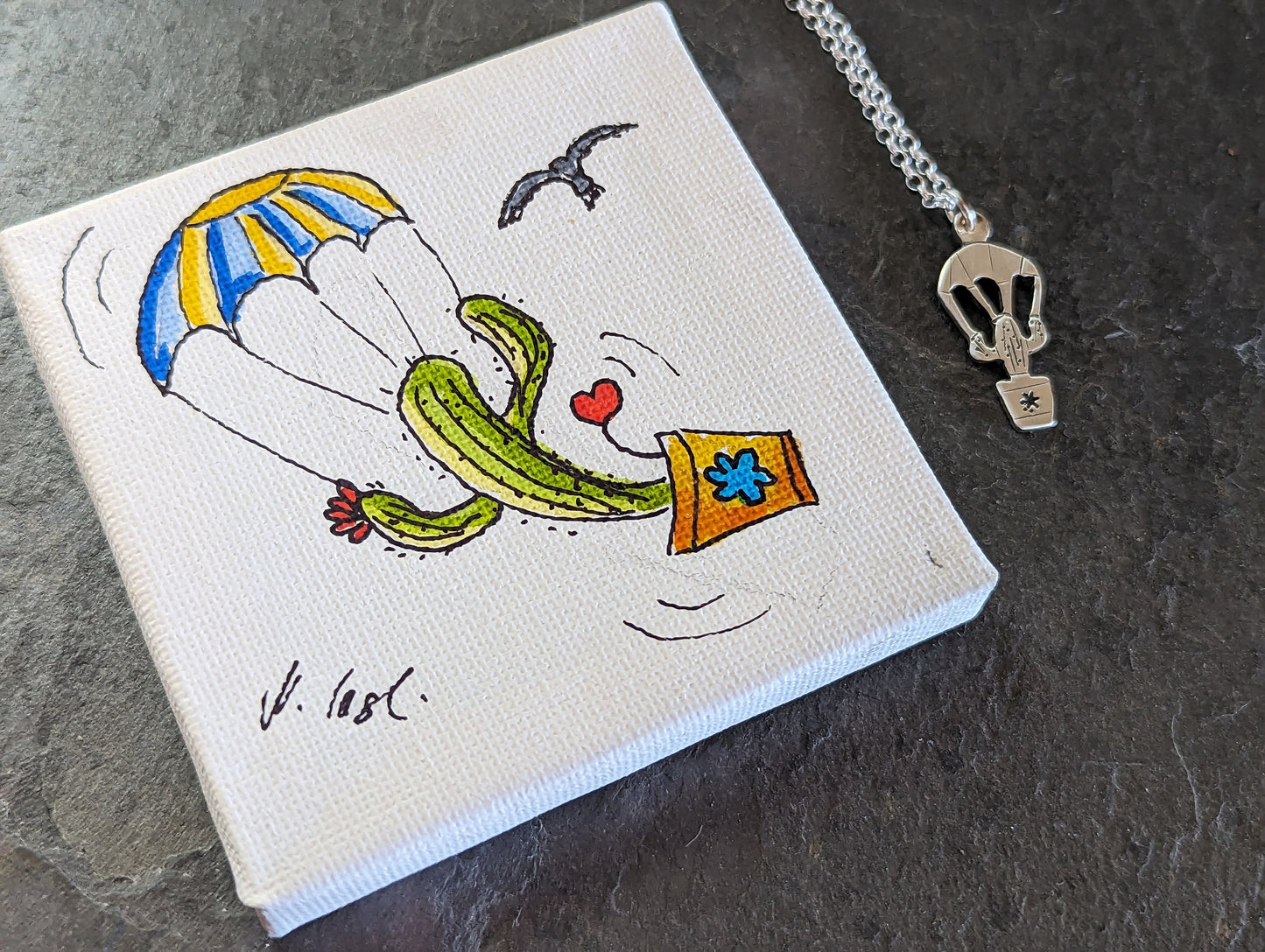 tiny silver parachuting cactus and mini drawing of cactus on parachute on stretched canvas ( Original art )