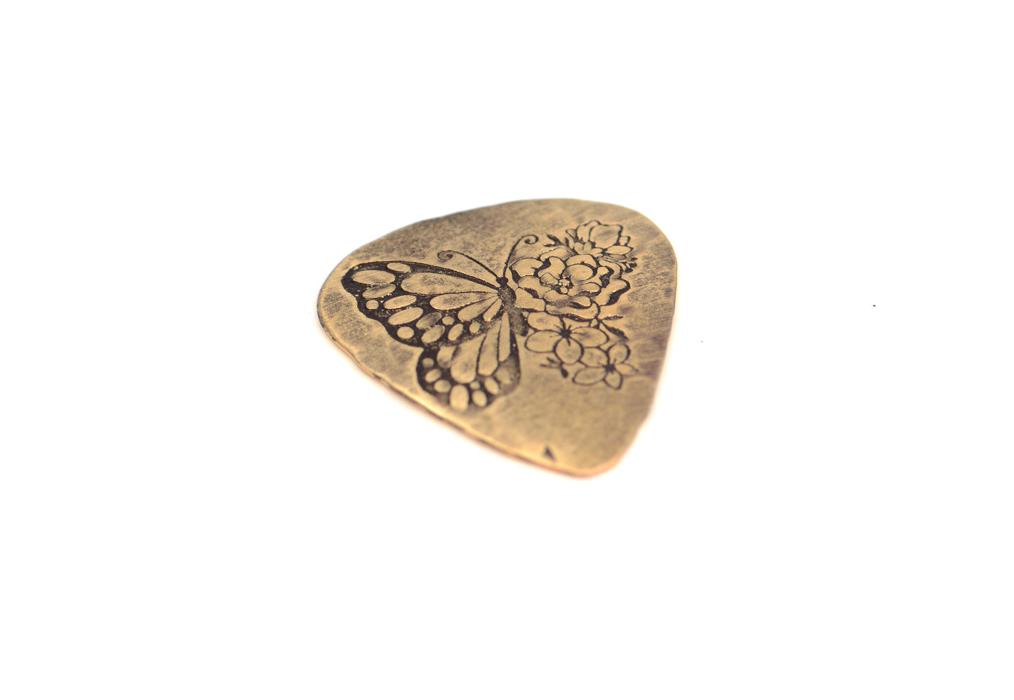 Bronze guitar pick with butterfly and flowers