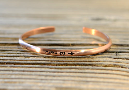 Copper bracelet with arrow and a heart in dainty styling for stacking
