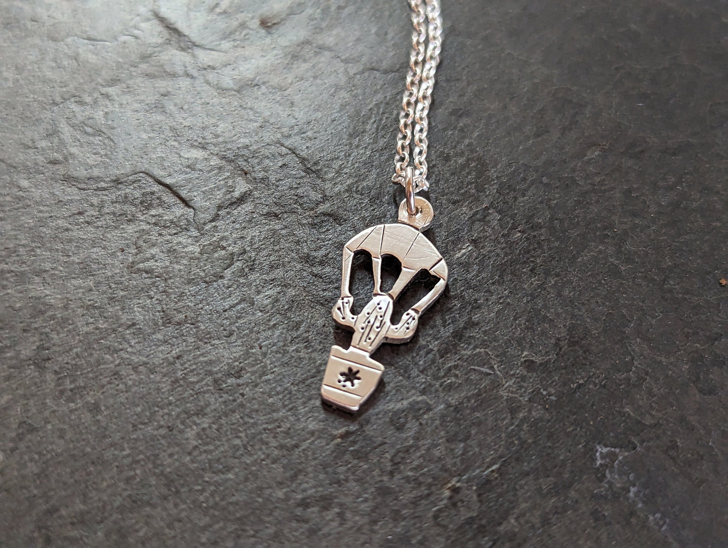 dainty sterling silver saguaro cactus charm on a parachute