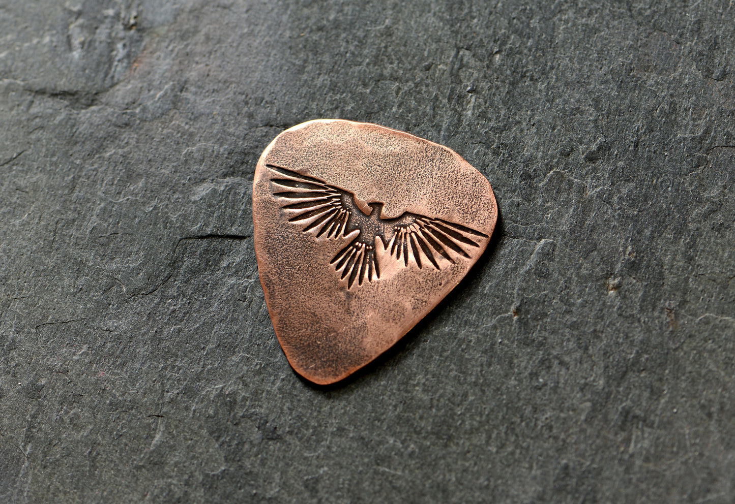 Copper guitar pick with Thunderbird