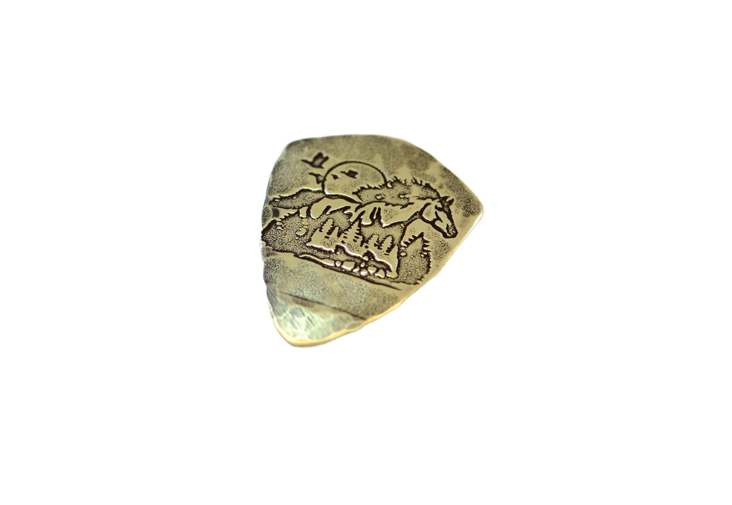 Shield shaped brass guitar pick with horse and forest